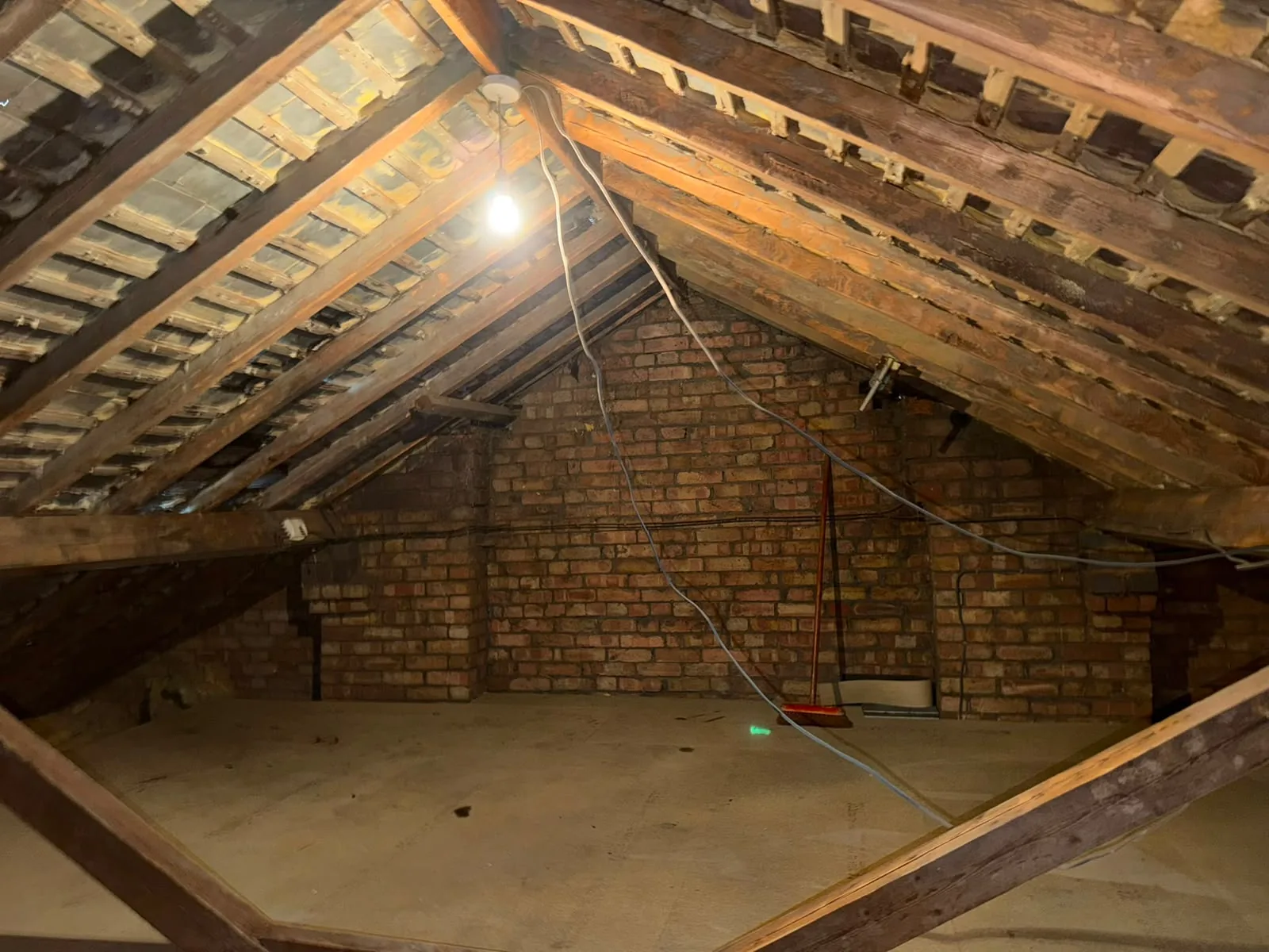 Cleared loft with the roof timbers fully exposed