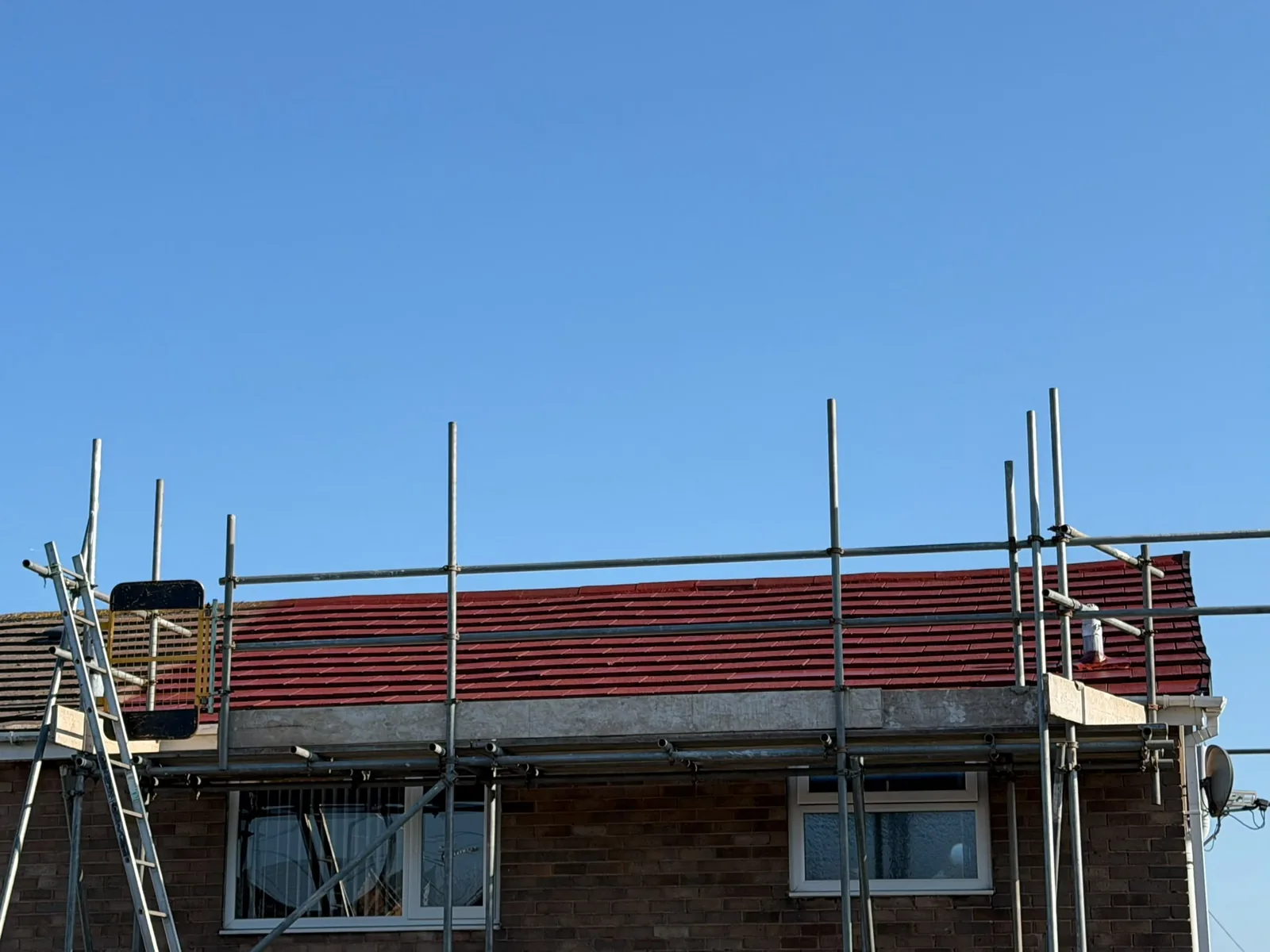 Scaffold set up for a roof job on a semi-detached house