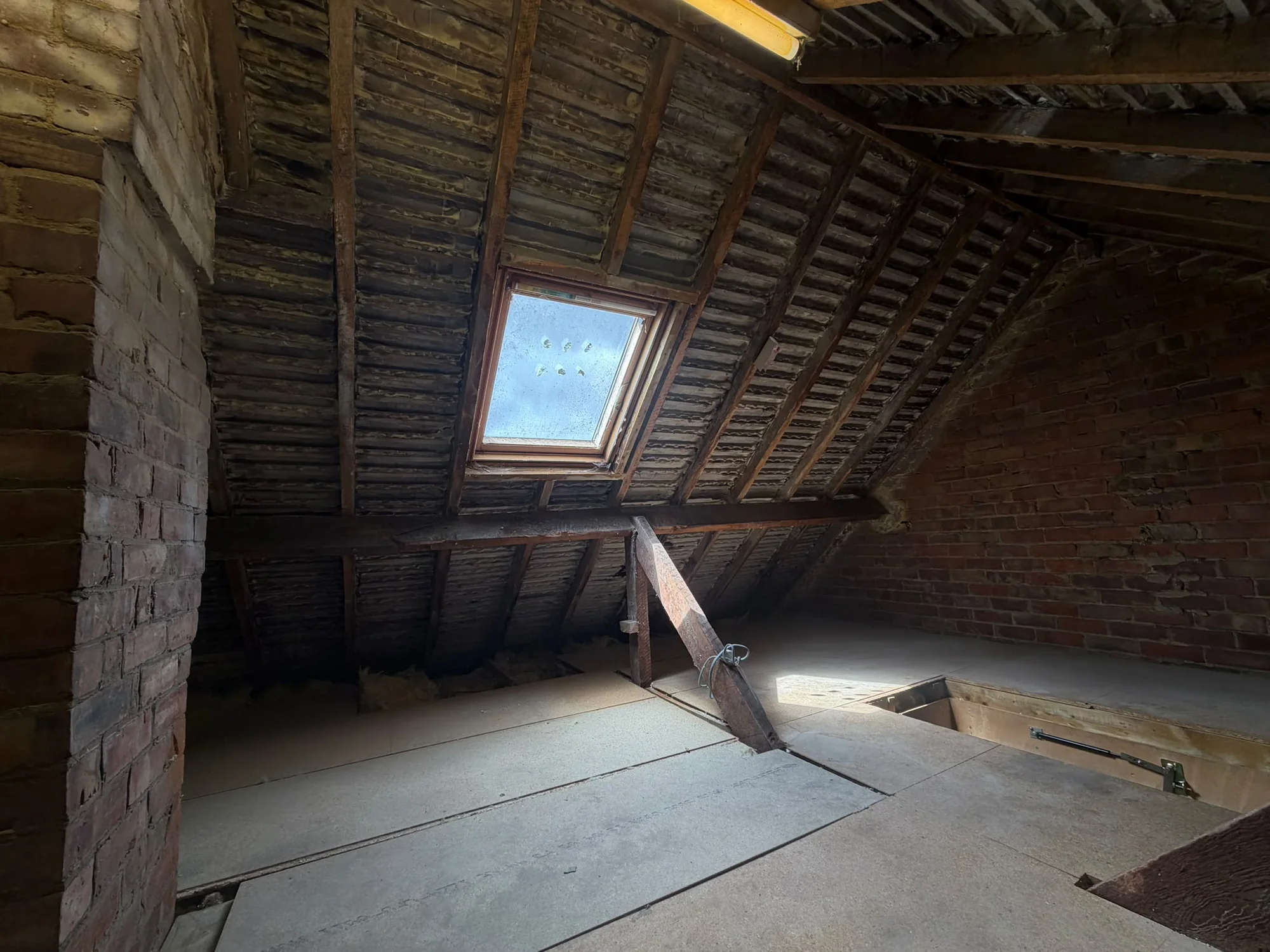 Cleared roof space with the timbers exposed and inspectable